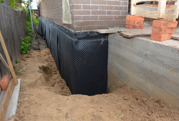 Happy homeowners after waterproofing job in Hillsdale